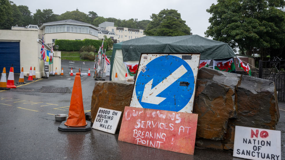 Protest signs outside Stradey Park Hotel