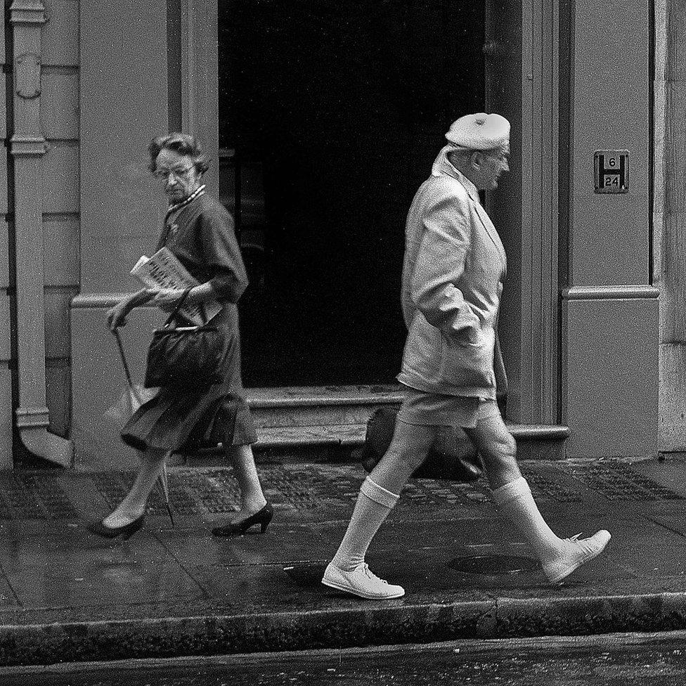 Woman glancing at Scottish gentleman, London 1956