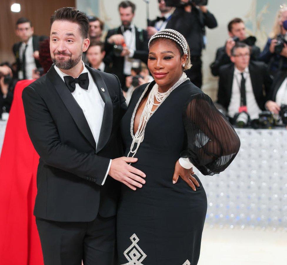 Serena Williams husband cradles her baby bump