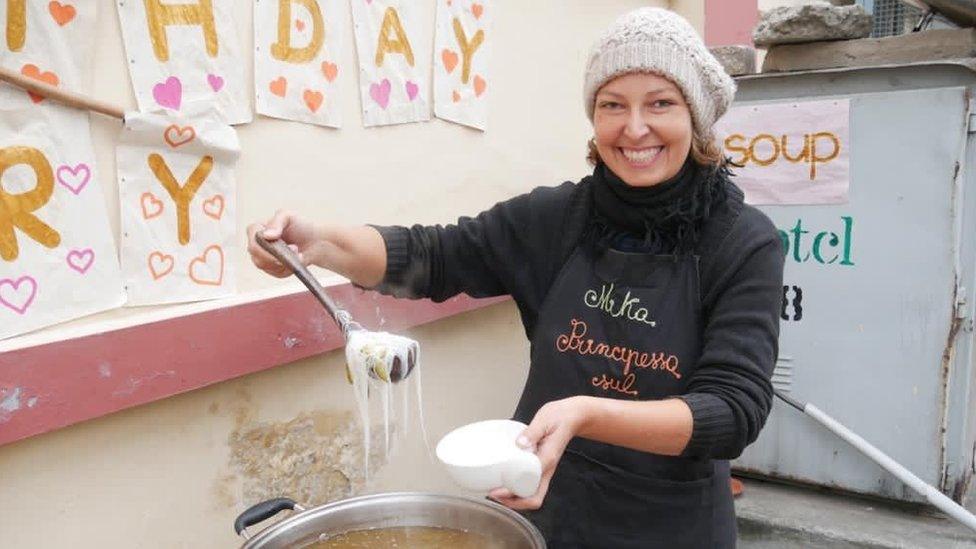 Dominika at the couple's soup serving station in Lahore, Pakistan