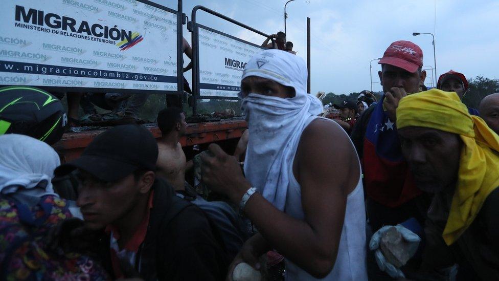 Demonstrators clash with Venezuelan police on the Francisco de Paula Santander bridge on the border Colombia, and Venezuela. Photo: 23 February 2019