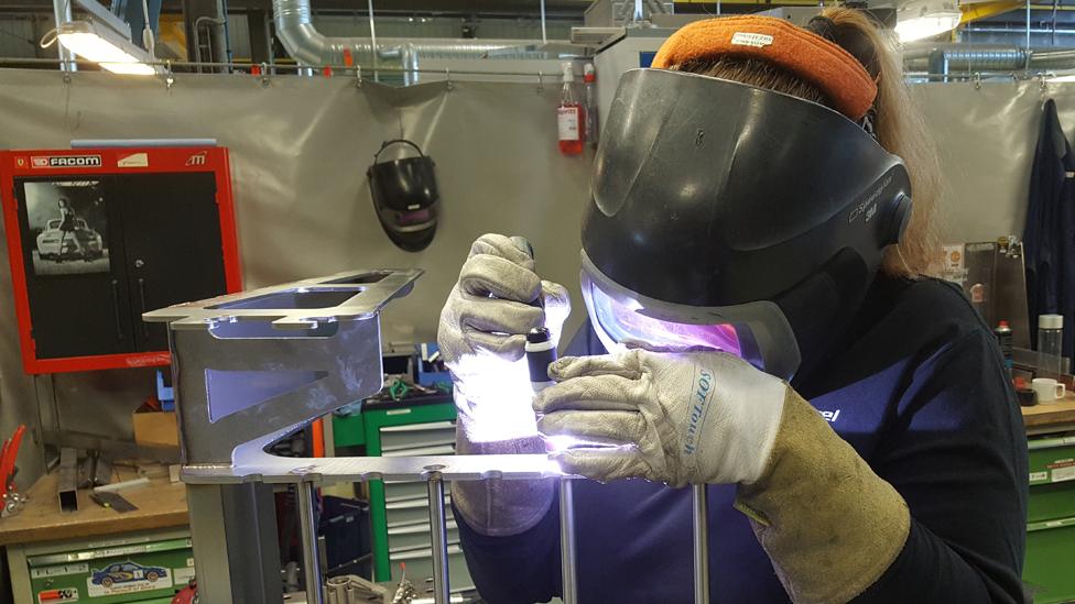 A Marel employee welding