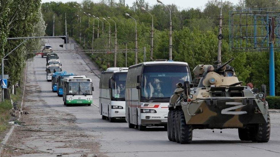 A photo purportedly showing Ukrainian soldiers being escorted in buses from Mariupol under a pro-Russian military escort. Photo: 17 May 2022