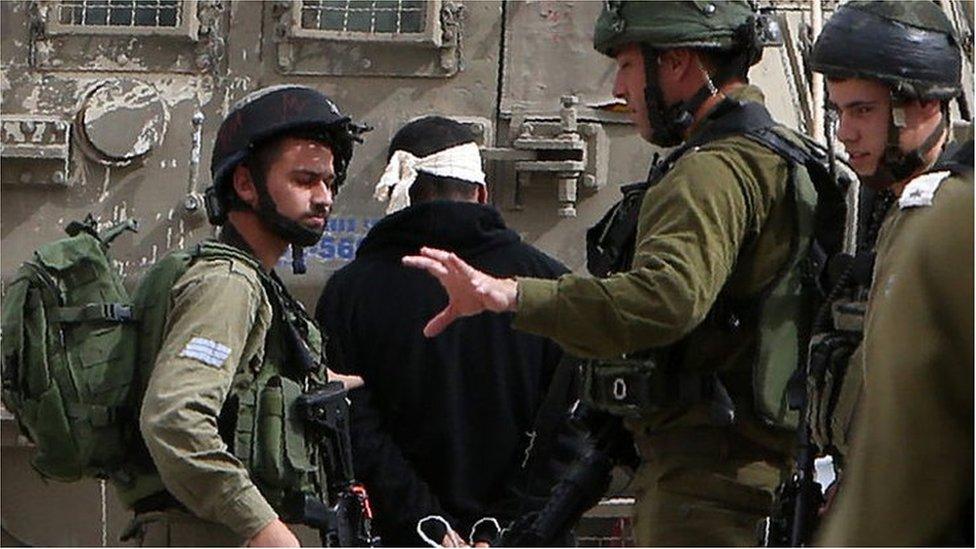 Palestinian arrested by Israeli soldiers (file photo)