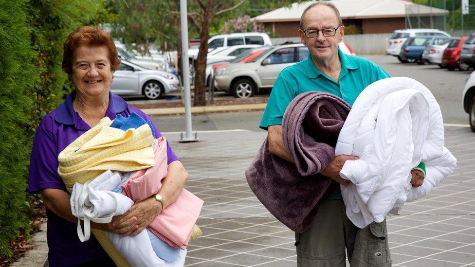 Volunteers drop of supplies to a bush fire evacuation centre at the Murray Leisure Centre in Pinjarra, Western Australia (08 January 2016)