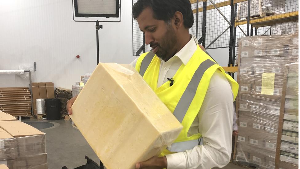 Block of cheddar at Combe Castle dairy