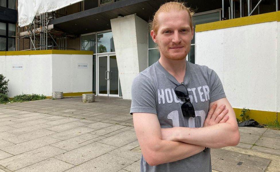 Gavin Thompson outside and in front of St Francis Tower, Ipswich