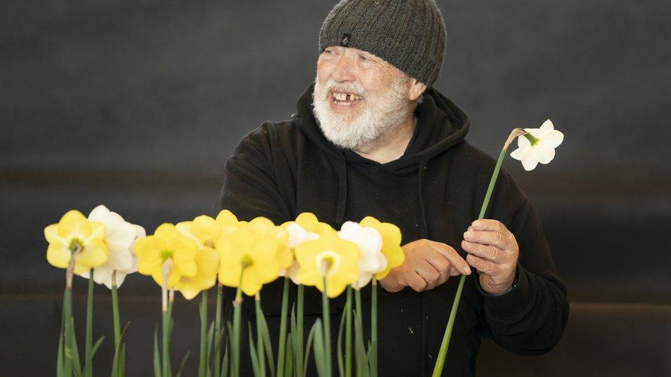 Man arranging flowers at Harrogate Flower Show