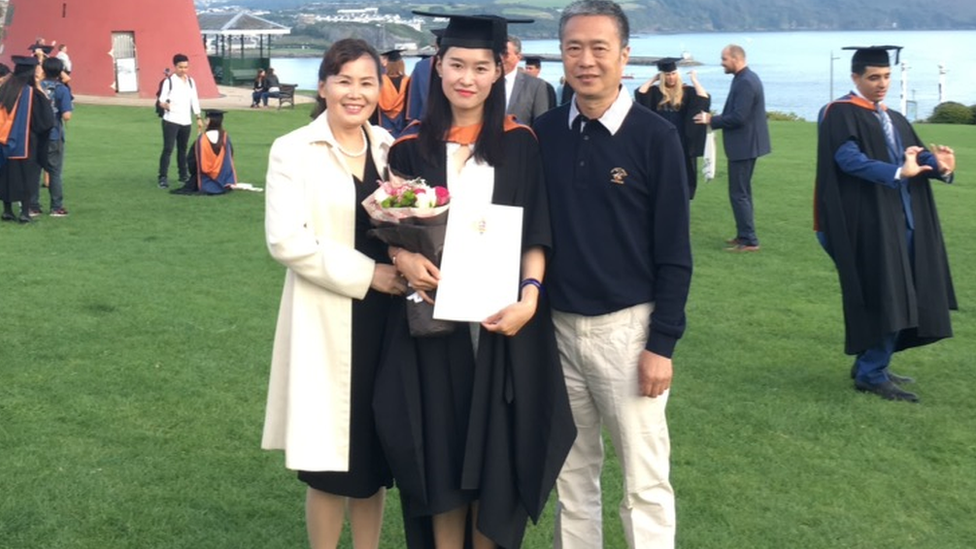 Zi Zeng with her parents