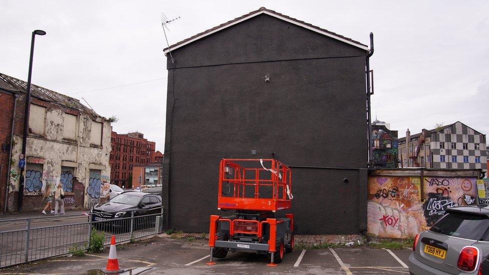 Wall painted black on Port Street in Manchester