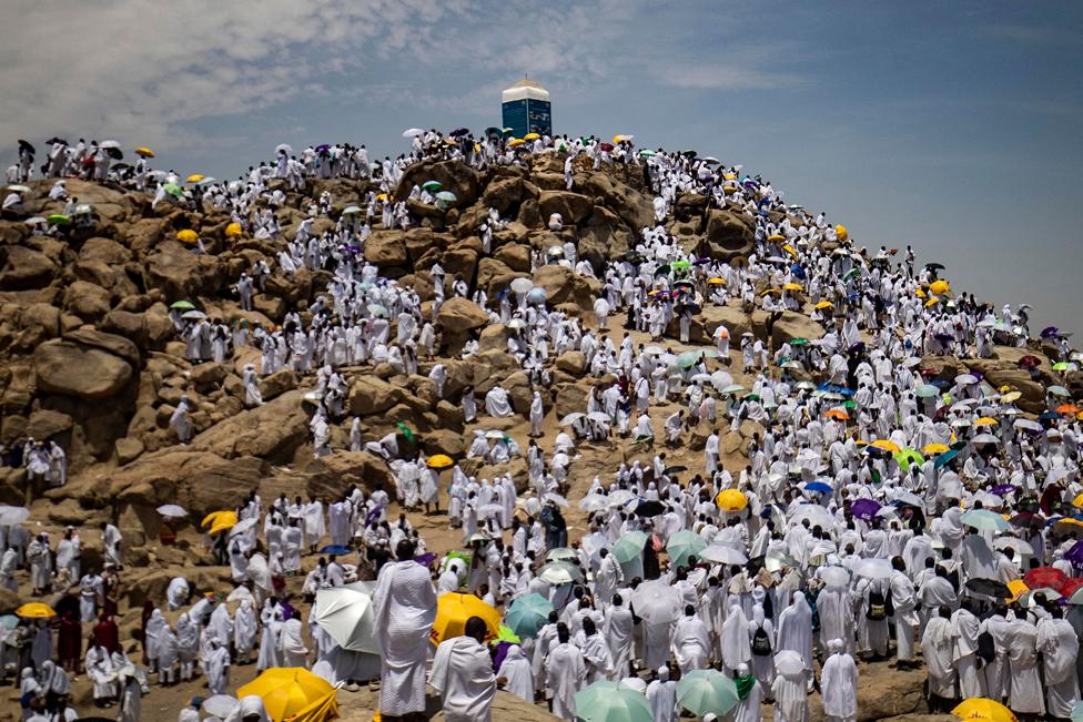 Muslim pilgrims gather at Mount Arafat, also known as Jabal al-Rahma (Mount of Mercy), southeast of the holy city of Mecca, during the climax of the Hajj pilgrimage, on 8 July, 2022.