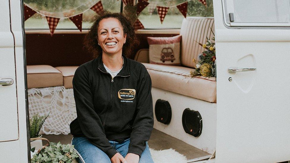 Nathalie Selvon-Bruce sitting in a VW campervan