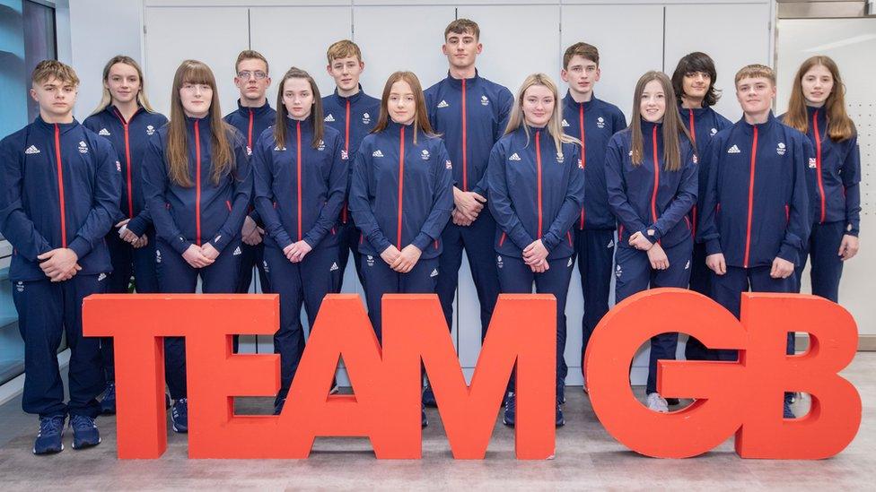 winter_youth_olympic_games_athletes_stand_together_in_uniform