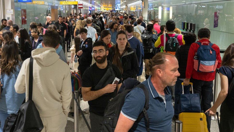 people-queuing-at-airport.