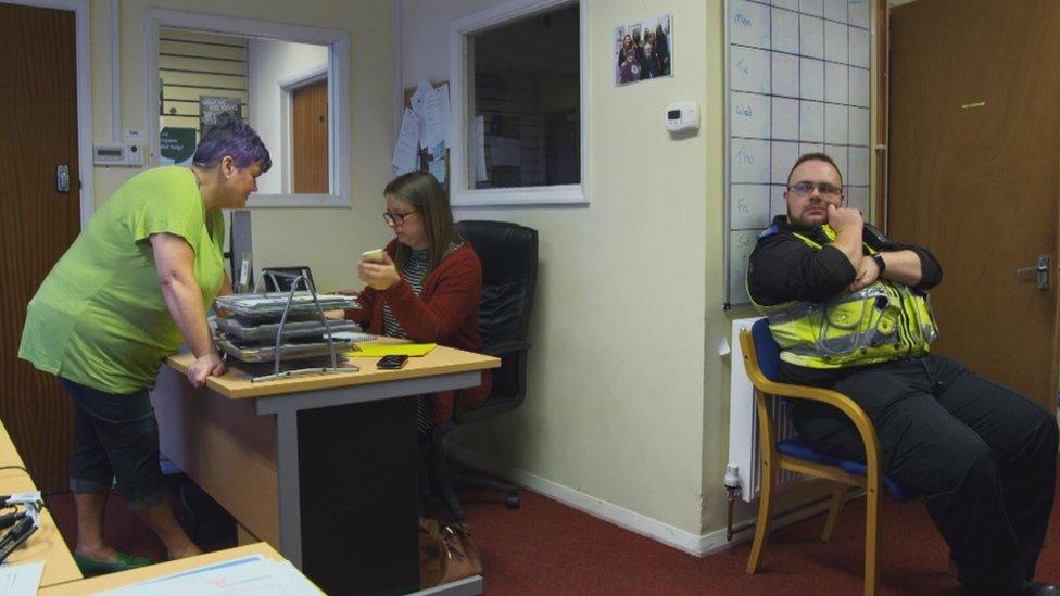 Policeman sat in Carolyn Harris' office