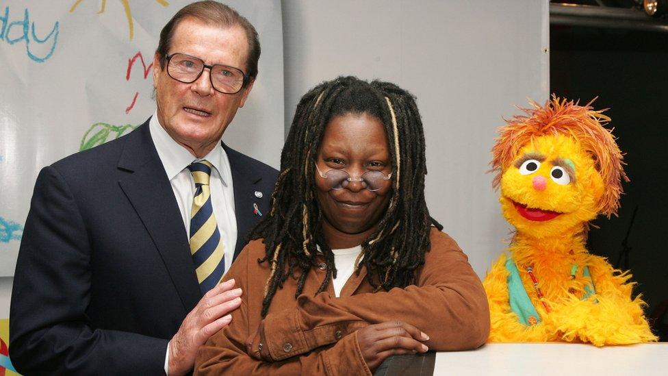 Roger Moore and Whoopi Goldberg