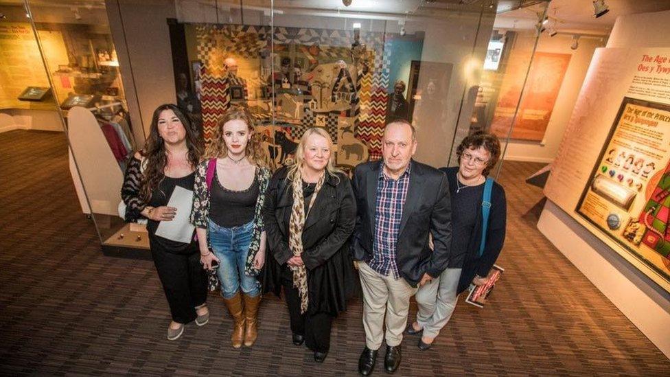 Tiffany Jayne-Davies and her family with the quilt