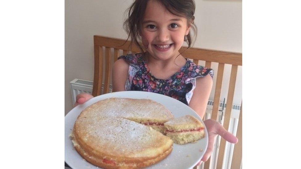 girl-holding-victoria-sponge-cake.