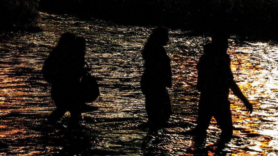 Central American migrants cross the Rio Grande river in Ciudad Juarez, state of Chihuahua, Mexico, on June 12, 2019, before turning themselves to US Border Patrol agents to ask for asylum.