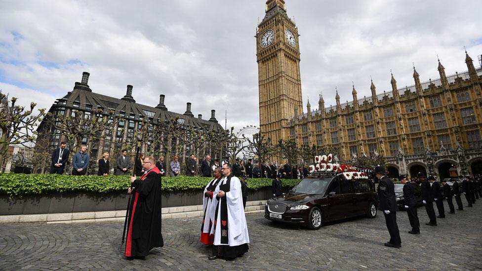 The hearse leaving the Houses of Parliament