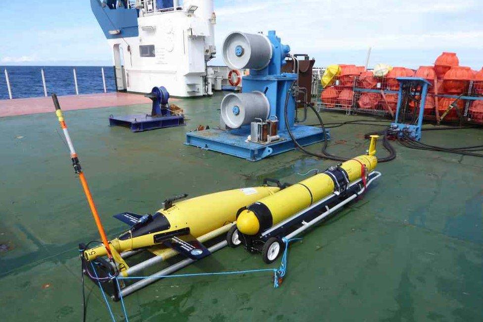 Gliders on deck of ship