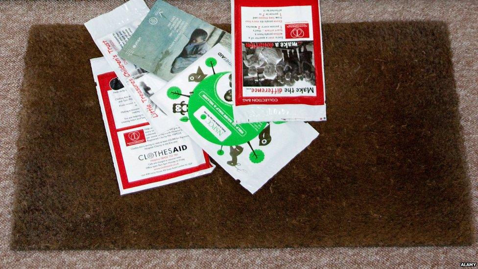 Charity mail-outs lying on doormat