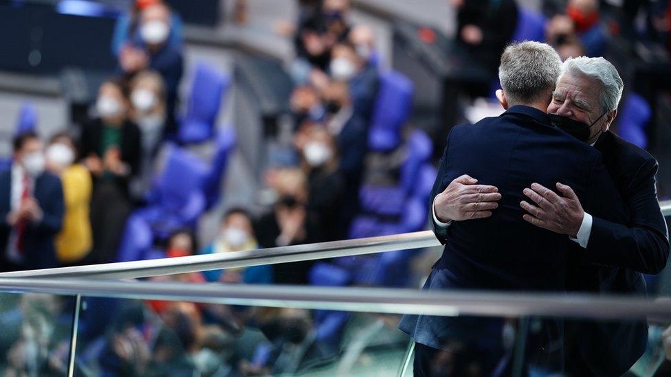 Former German President Joachim Gauck (R) hugs Ukrainian ambassador to Germany Andrij Melnyk (L) prior to a government declaration at the German parliament "Bundestag" in Berlin, Germany, 27 February 2022