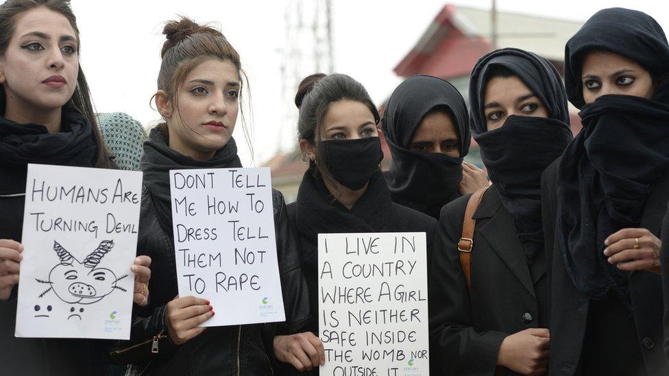 Kashmiri law students hold placards during a protest calling for justice following the rape and murder of an eight-year-old girl in the Indian state of Jammu and Kashmir, in Srinagar on 18 April, 2018