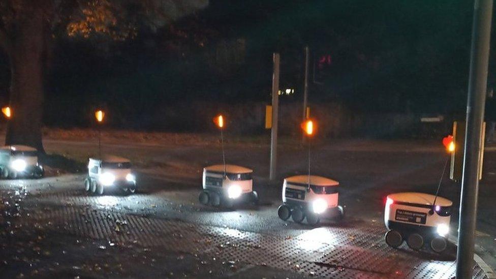 Robots queuing to cross a road in Cambridge