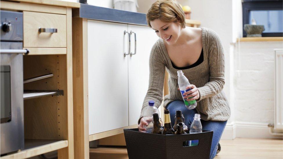 Woman recycling