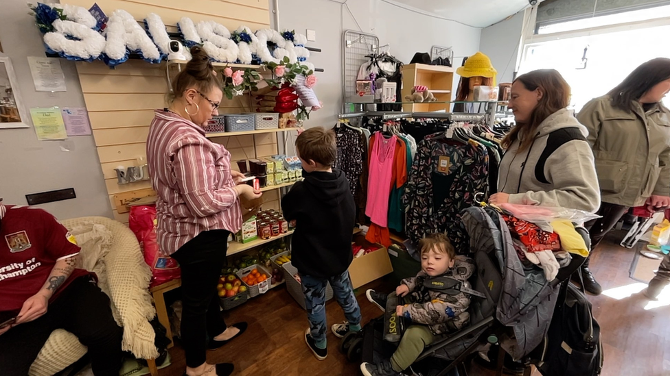 Families choosing their lunch in Fairstead Community Shop in King's Lynn