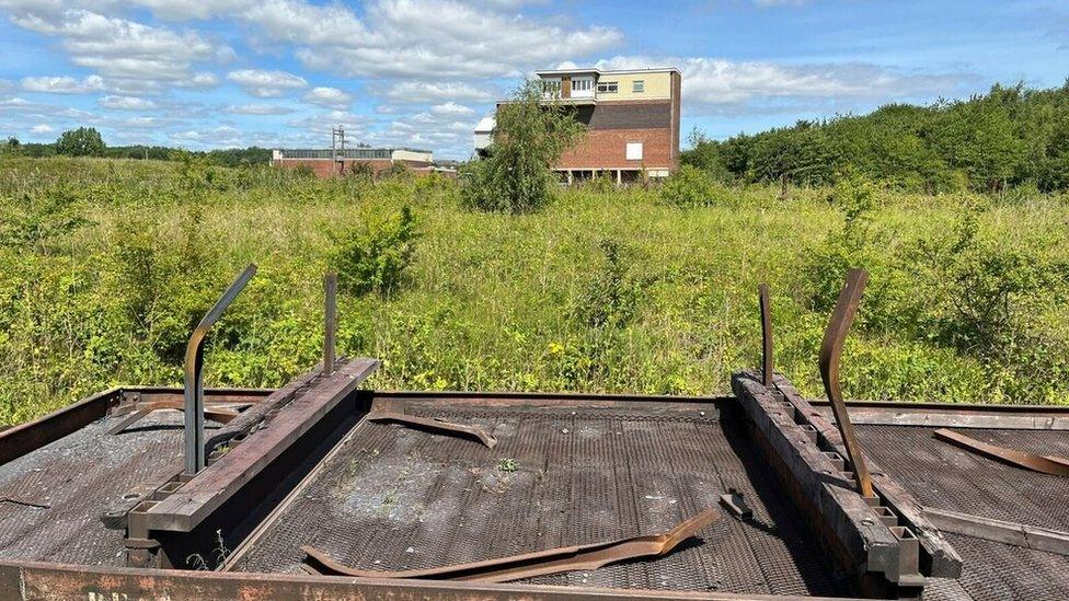 Tees Marshalling Yard Control Tower in vegetation, pictured in 2022