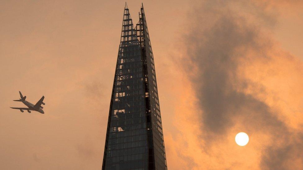 Red sun in sky above Shard