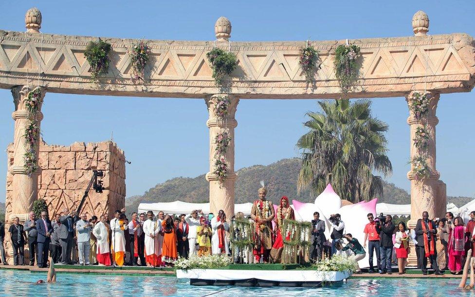 Vela Gupta and her husband Indian-born Aaskash Jahajgarhia posing with relatives and guests during ceremonies for their wedding in Sun City, South Africa, on May 1, 2013