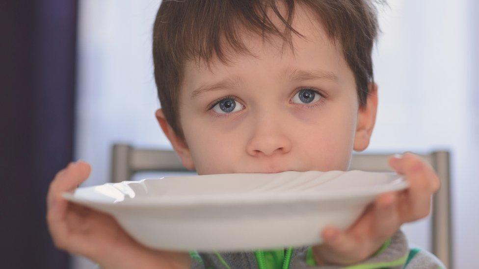 Boy waiting for dinner