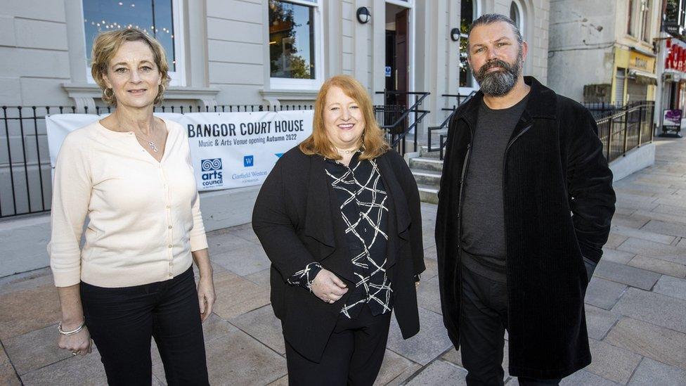 NI Justice Minister Naomi Long (centre), with Open House founders Alison Gordon (left) and Kieran Gilmore (right), ahead of the opening of The Court House, in Bangor, Northern Ireland which has been repurposed from a Bangor Courthouse.