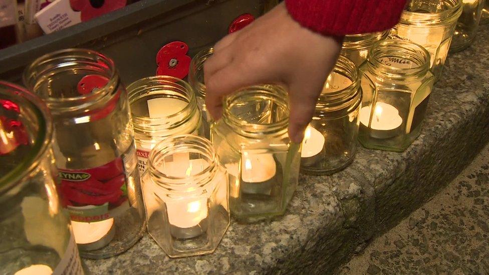 Candles in jars on street