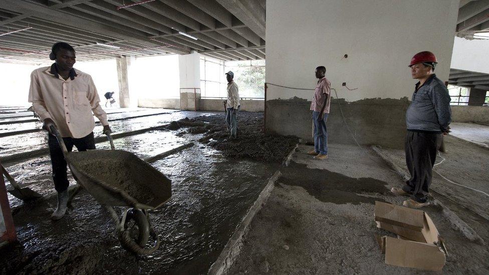 A Chinese constructor Liou stands next to a May 13, 2014 site in Nairobi.