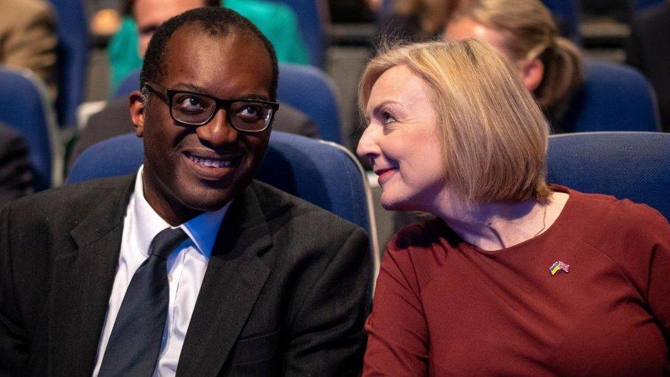 Kwasi Kwarteng sits next to former prime minister Liz Truss