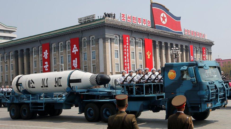 Military vehicles carry missiles with characters reading "Pukkuksong" during a military parade marking the 105th birth anniversary of North Korea"s founding father, Kim Il Sung, in Pyongyang