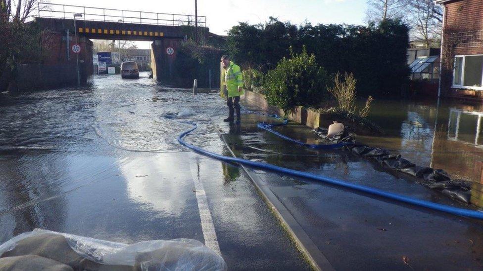 Temporary flood barrier by the railway bridge in Romsey