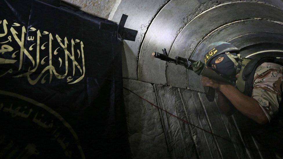 A Palestinian militant from the Islamic Jihad's armed wing standing in a tunnel (3 March 2015)