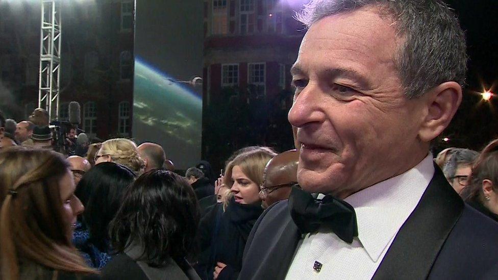 Disney's chief executive, Bob Iger, on the Star Wars red carpet in London. He says he wants Sky News to carry on.