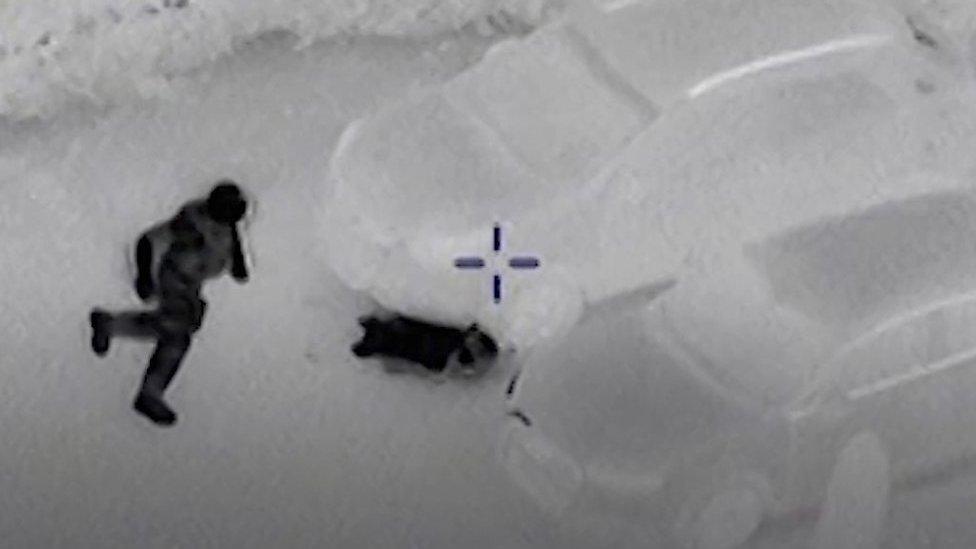 Man hiding from police under car