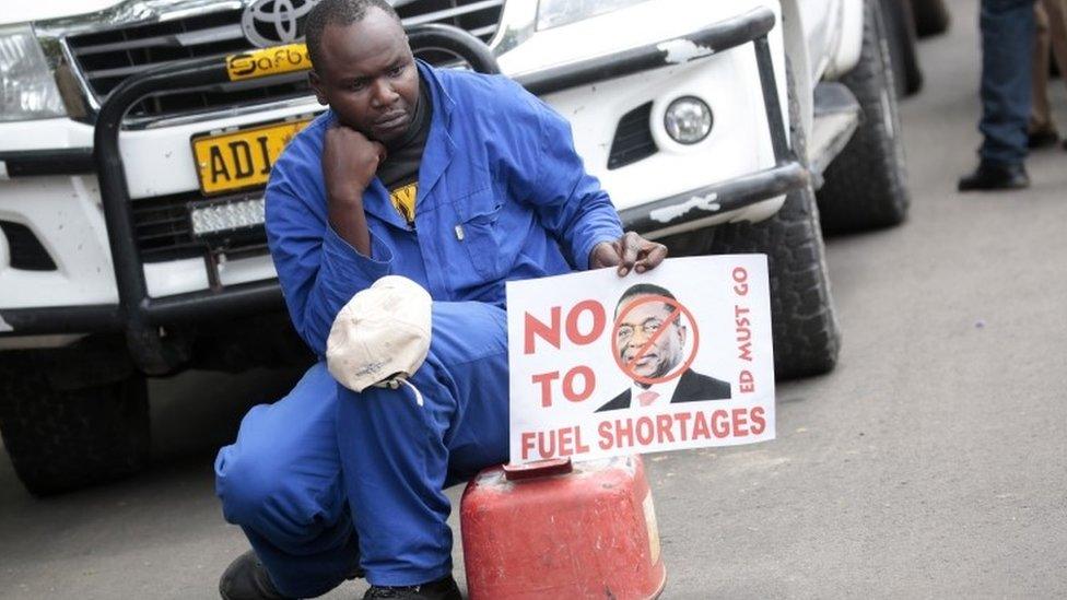 A protester with a fuel container, due to the continuing fuel crisis,as Movement For Democratic Change (MDC) Alliance party members gather in the Africa Unity Square, in Harare, Zimbabwe, 29 November 2018, to protest against the current economic situation facing the country.