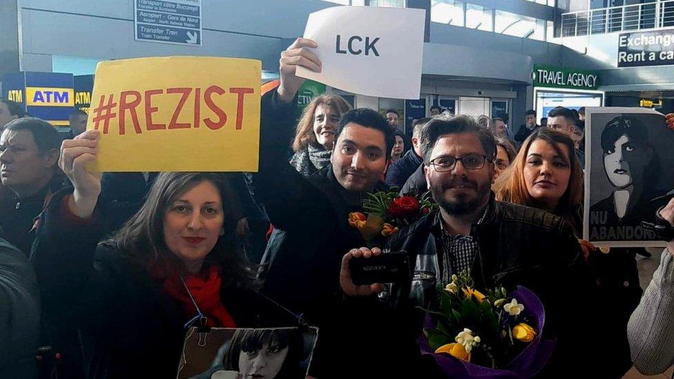 Supporters with flowers