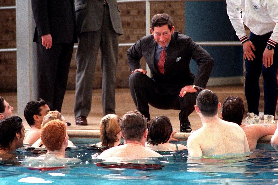 Prince of Wales joking with a group of unemployed youths during a visit to Warner Holiday Centre, Caister-On_Sea, Norfolk