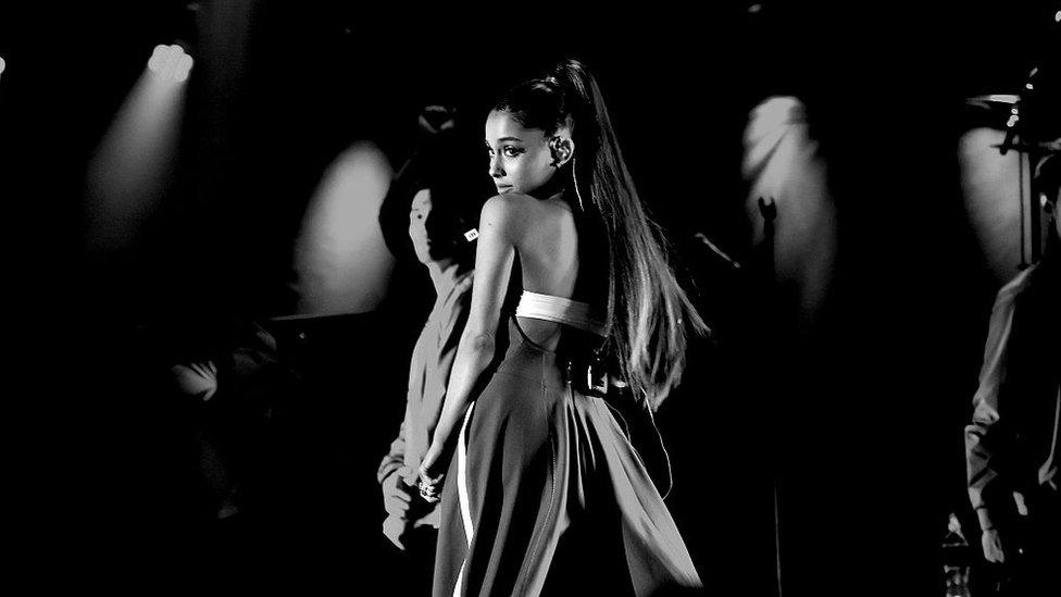 Black and white shot of Ariana performing