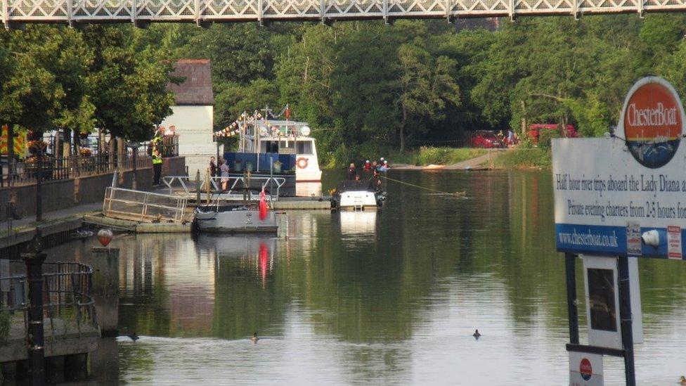 Police search river