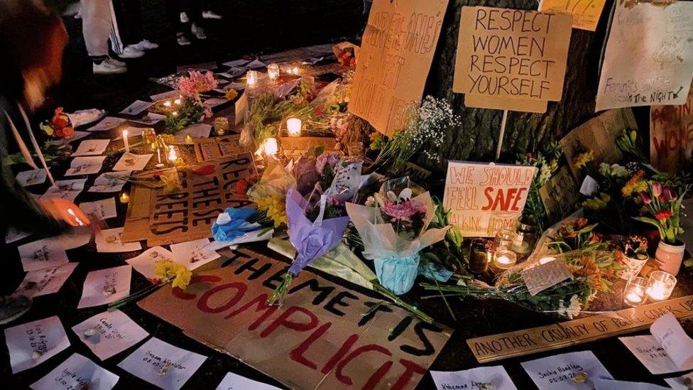 Placards and candles at the vigil